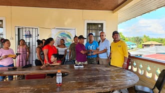 Some members of the Micobie community with Ian G. Hall of Guyanese United and Toshao Cornel Edwards of Micobie